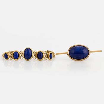 A brooch and bracelet set with cabochon cut lapis lazuli.