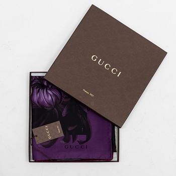 Gucci, a silk scarf.