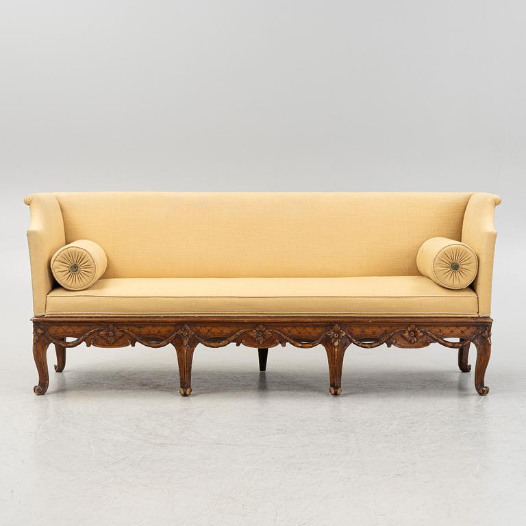 A carved Rococo sofa, 18th Century.