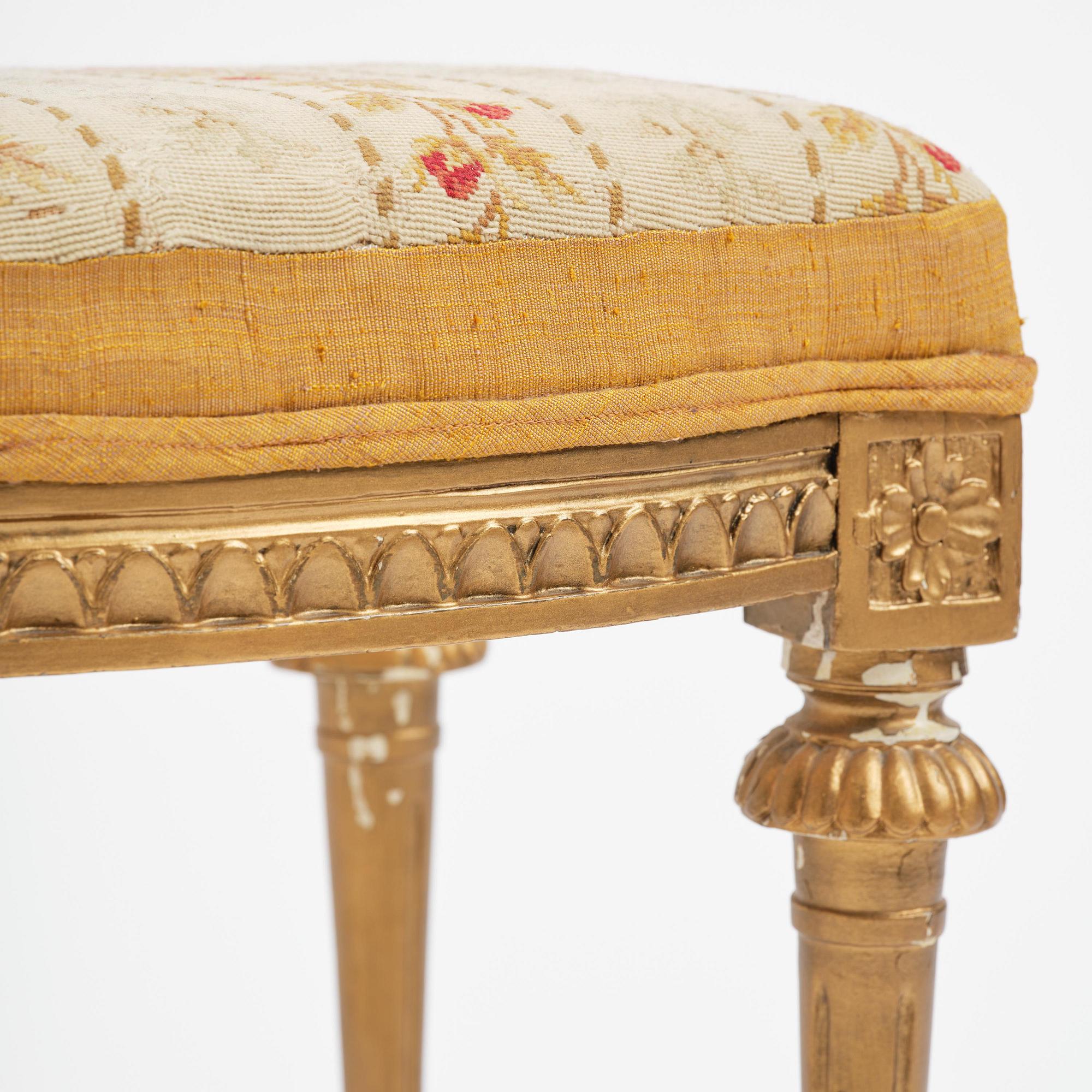 A pair of giltwood stools by E. Ståhl (master in Stockholm 1794-1820).