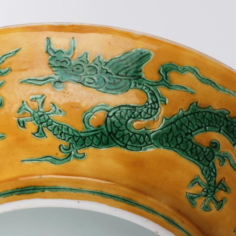 A yellow and green glazed anhua decorated five clawed dragon dish,  Qing dynasty with Jiajing mark.