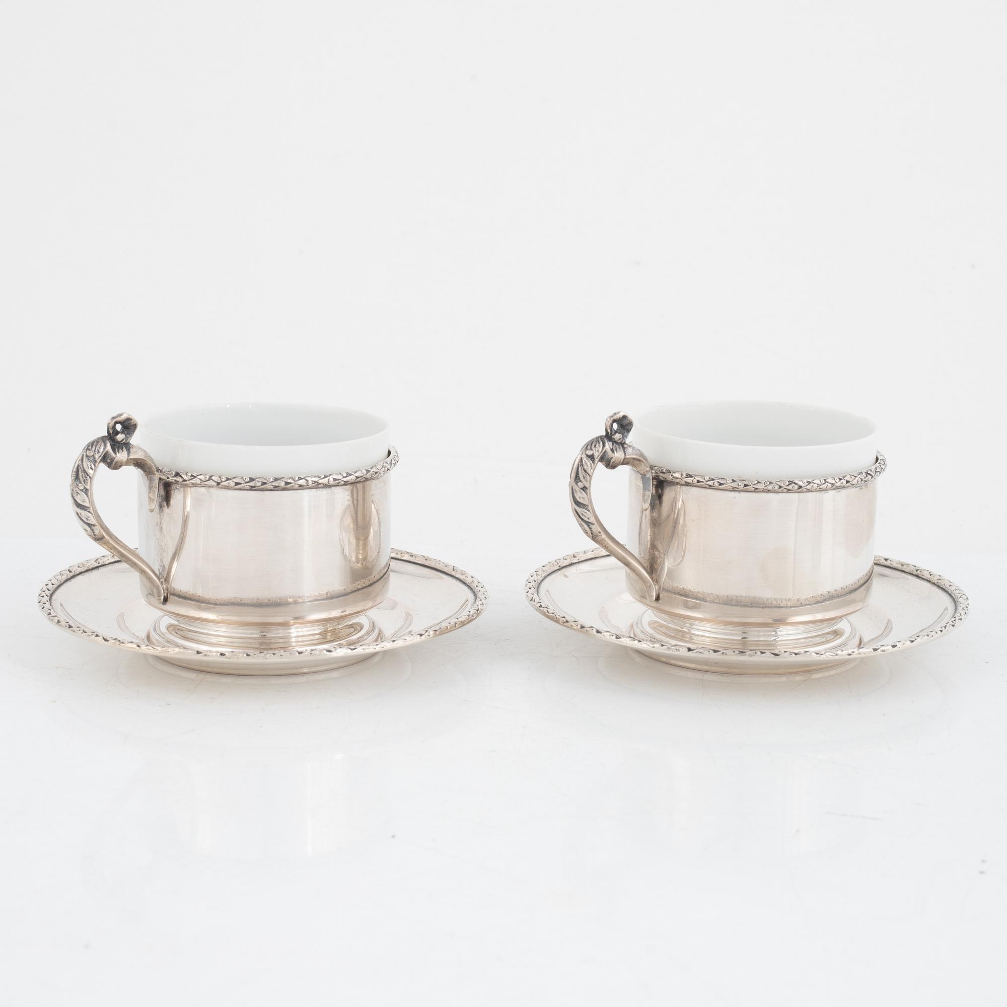 Silver tea mug holders with saucers, Pest, Austria, around 1900.
