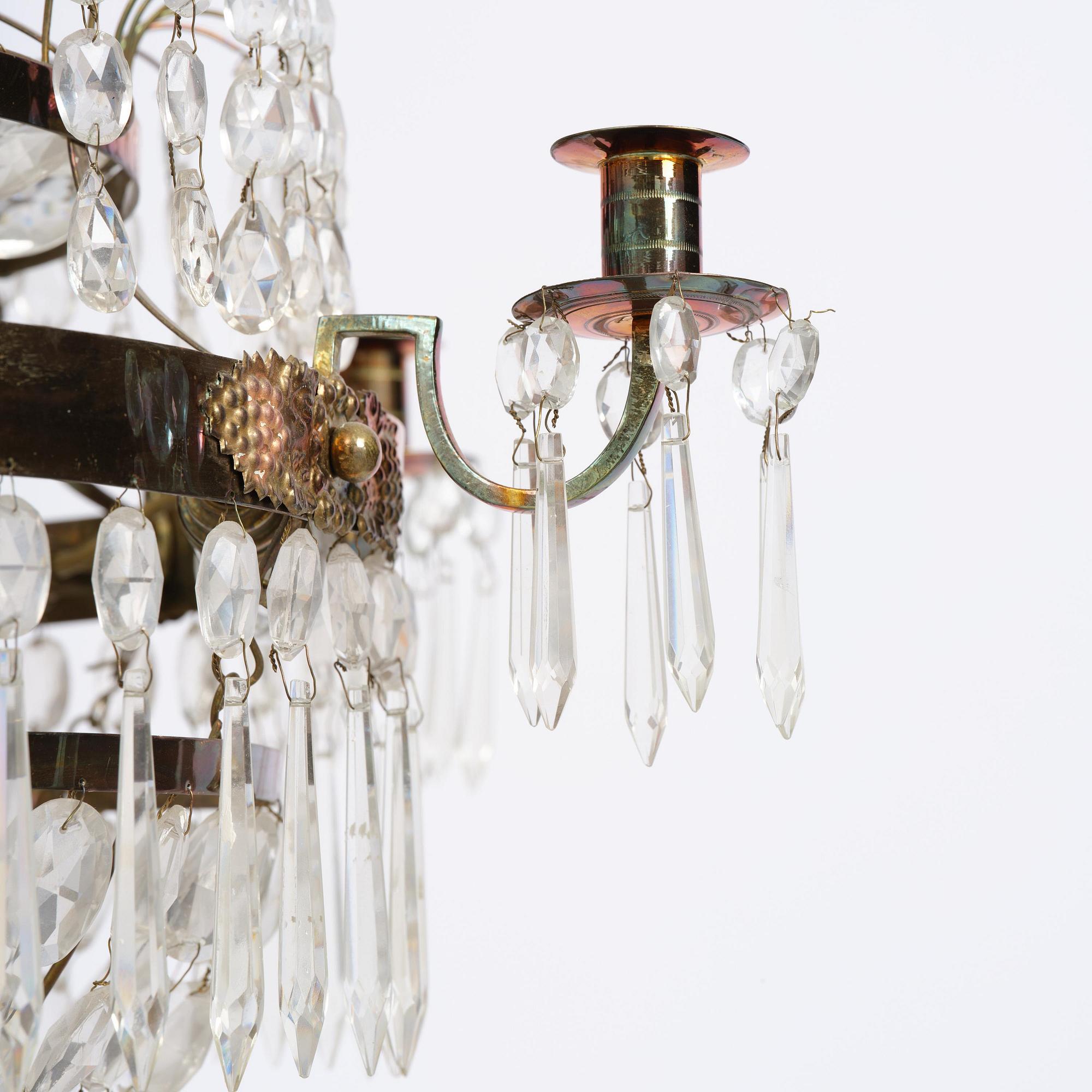 An Empire gilt brass and cut glass seven-light chandelier, Sweden, early 19th century.