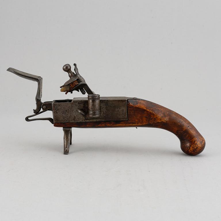 A 18th Century Flintlock lighter.