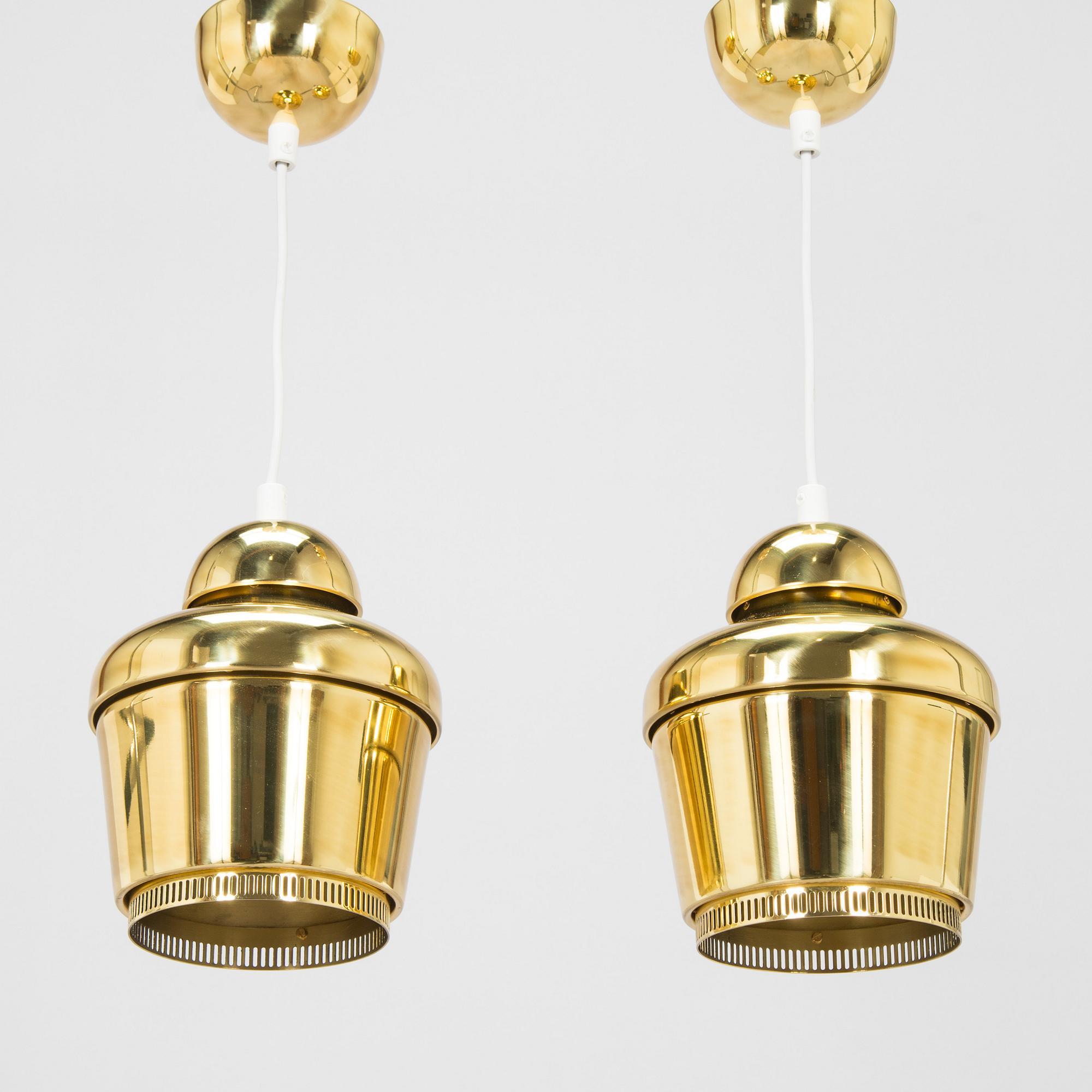 Alvar Aalto, A pair of  A 330, 'Golden Bell' pendant lights A330 for Artek, 2000s.