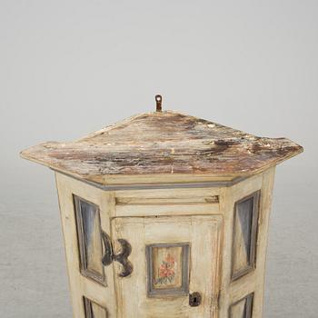 A 18th century corner cabinet.