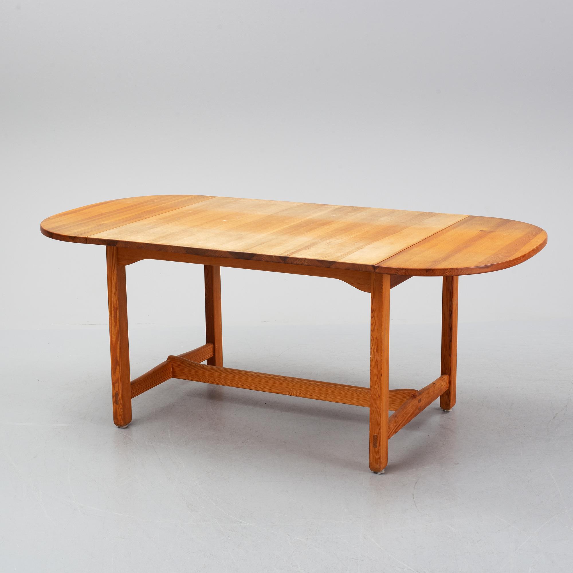 Carl Malmsten, a pine dining table and 6 chairs.