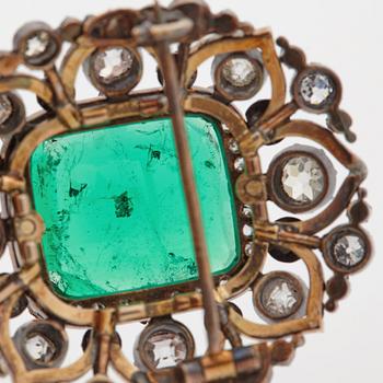 An emerald, black enamel and old cut diamond brooch. 19th century.