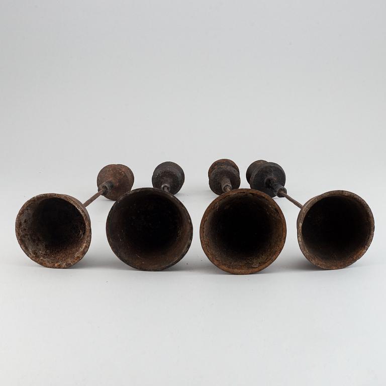 A group of four temple candle sticks, China, 20th Century.