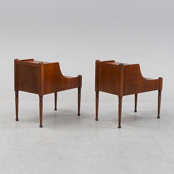 A pair of mahogany veneered bedside tables, later part of the 20th Century.