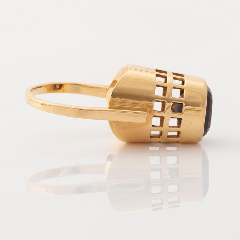 An 18K gold and smoke quartz Sigurd Persson ring.