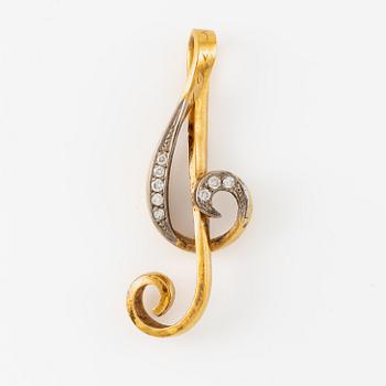 Pendant, in the form of a G-clef, 23K gold with brilliant-cut diamonds.