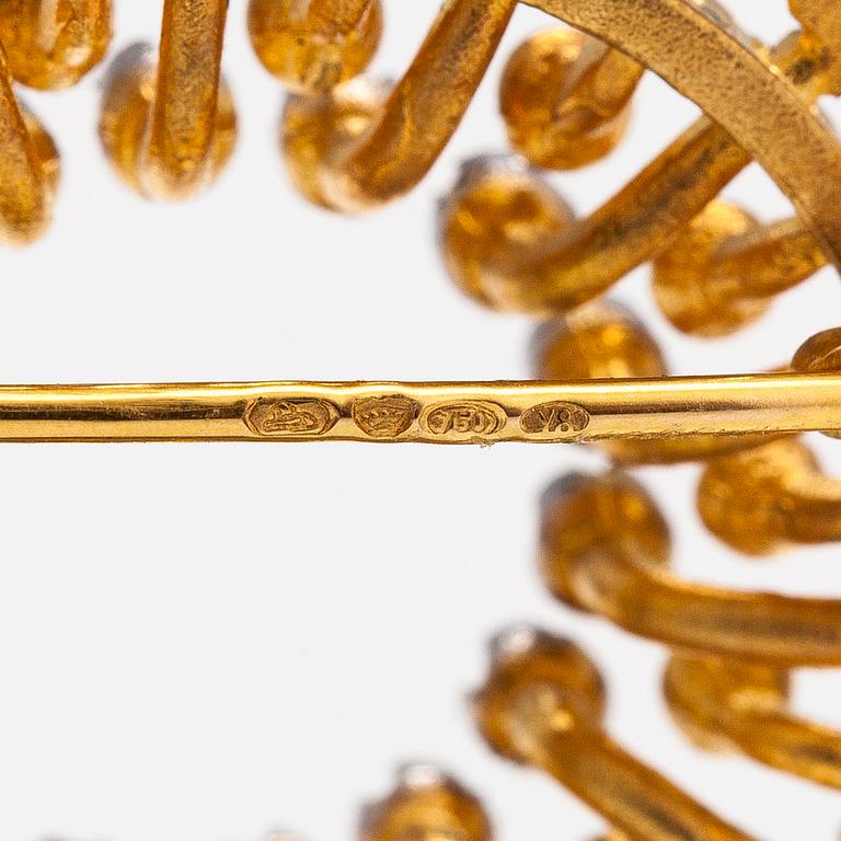 Tapio Wirkkala,  "Sun", an 18K gold brooch with diamonds ca 0.13 ct in total. Kultakeskus, Hämeenlinna 2000.