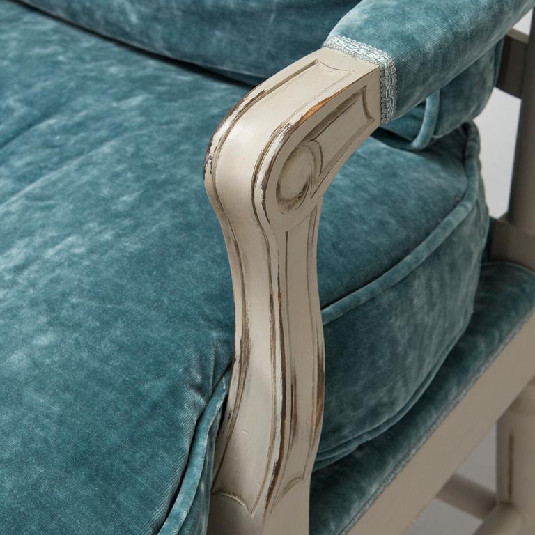 A Gustavian style armchair from the latter half of the 20th century.