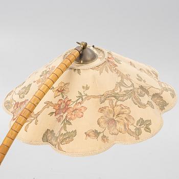 A 1930's/40's floor lamp with table.