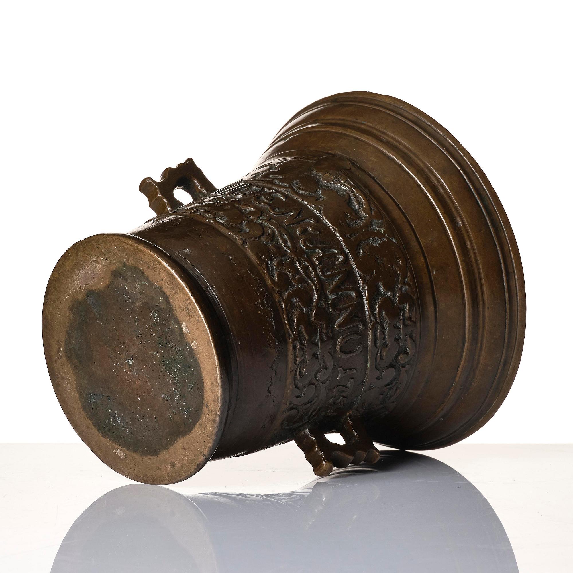 A Swedish late baroque bronze mortar and pestle, dated 1759.