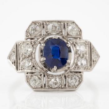 Platinum ring with sapphire and old-cut diamonds.