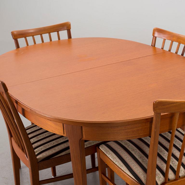 A DINNING TABLE AND FOUR CHAIRS BY CARL MALMSTEN FOR BODAFORS.