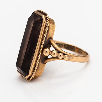 A 14K gold ring with a smoaky quartz. Asser Peltonen, Vantaa.