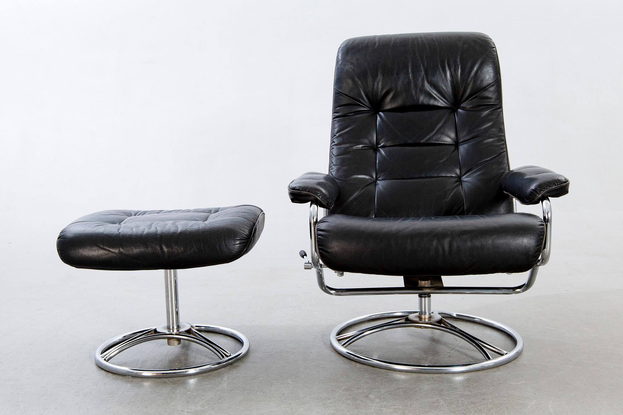 A leather swivel armchair and stool, Söderbergs  1980s.
