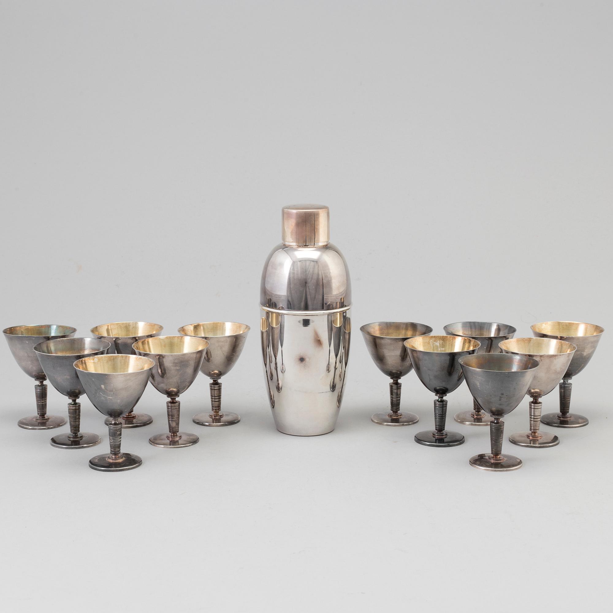 A silverplated shaker and 12 cocktail glasses from GAB and and a Shaker from CG Hallberg, Stockholm mid 20th century.