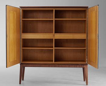 An Otto Schulz mahogany and artificial leather cabinet by Boet Sweden 1940's.