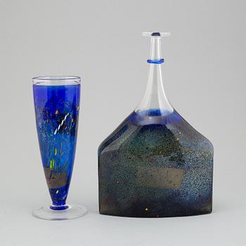 A glass flask and vase by Bertil Vallien, kosta boda, signed and numbered 89254 and 7049250, late 20th century.