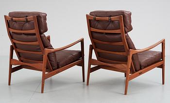 A pair of Ib Kofod Larsen teak and brown leather easy chairs, OPE Möbler, Sweden 1960's.