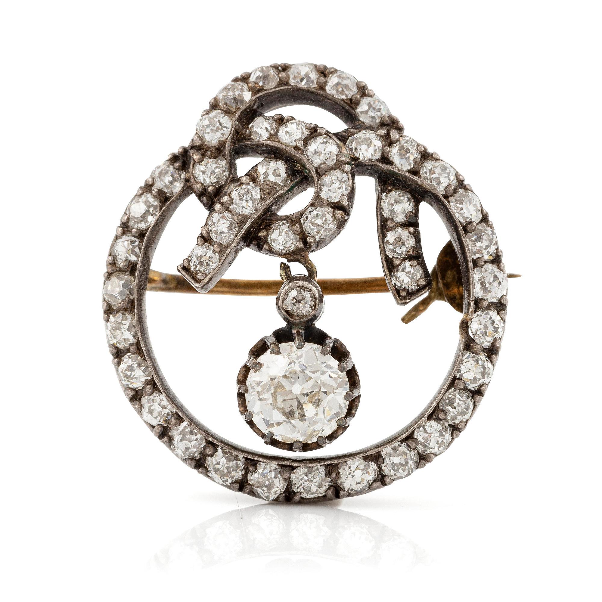 A brooch, silver and gold set with old-cut diamonds.
