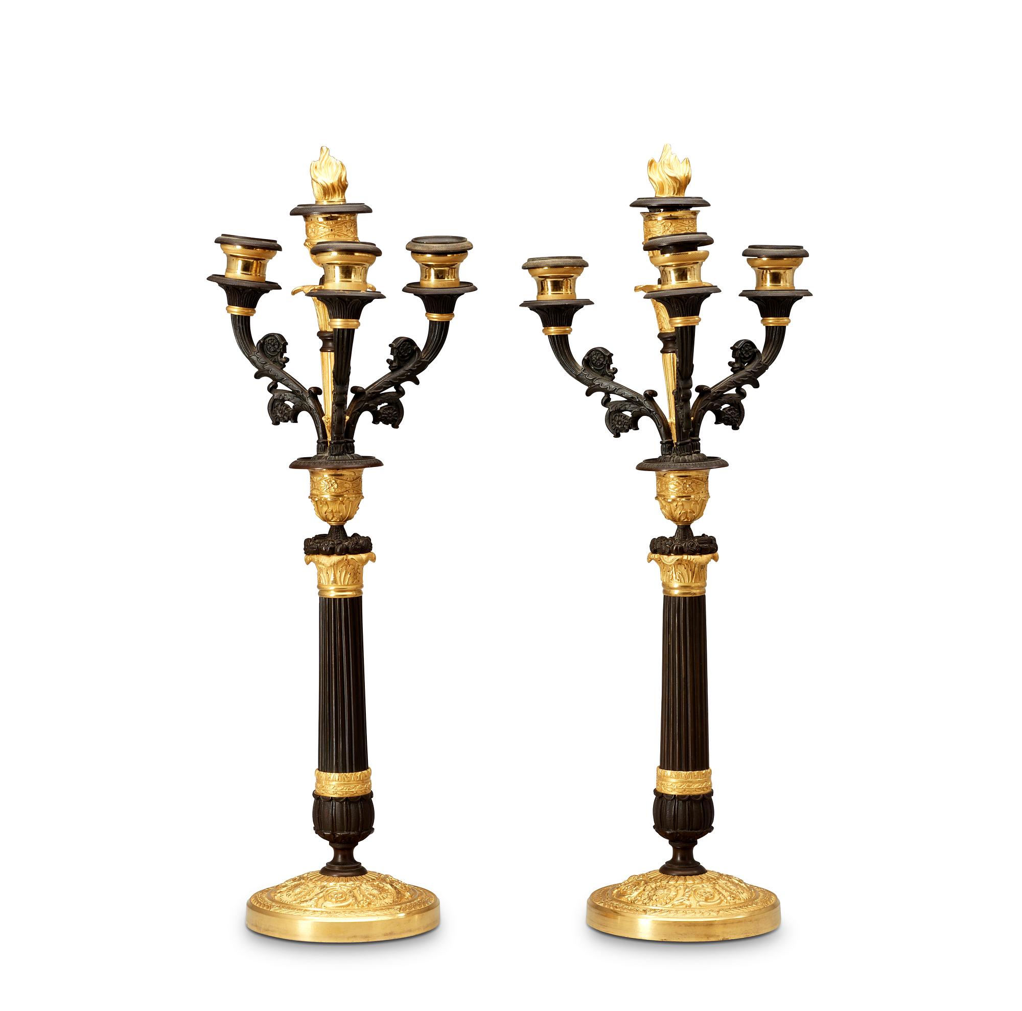 A pair of French Empire 19th century four-light candelabra.
