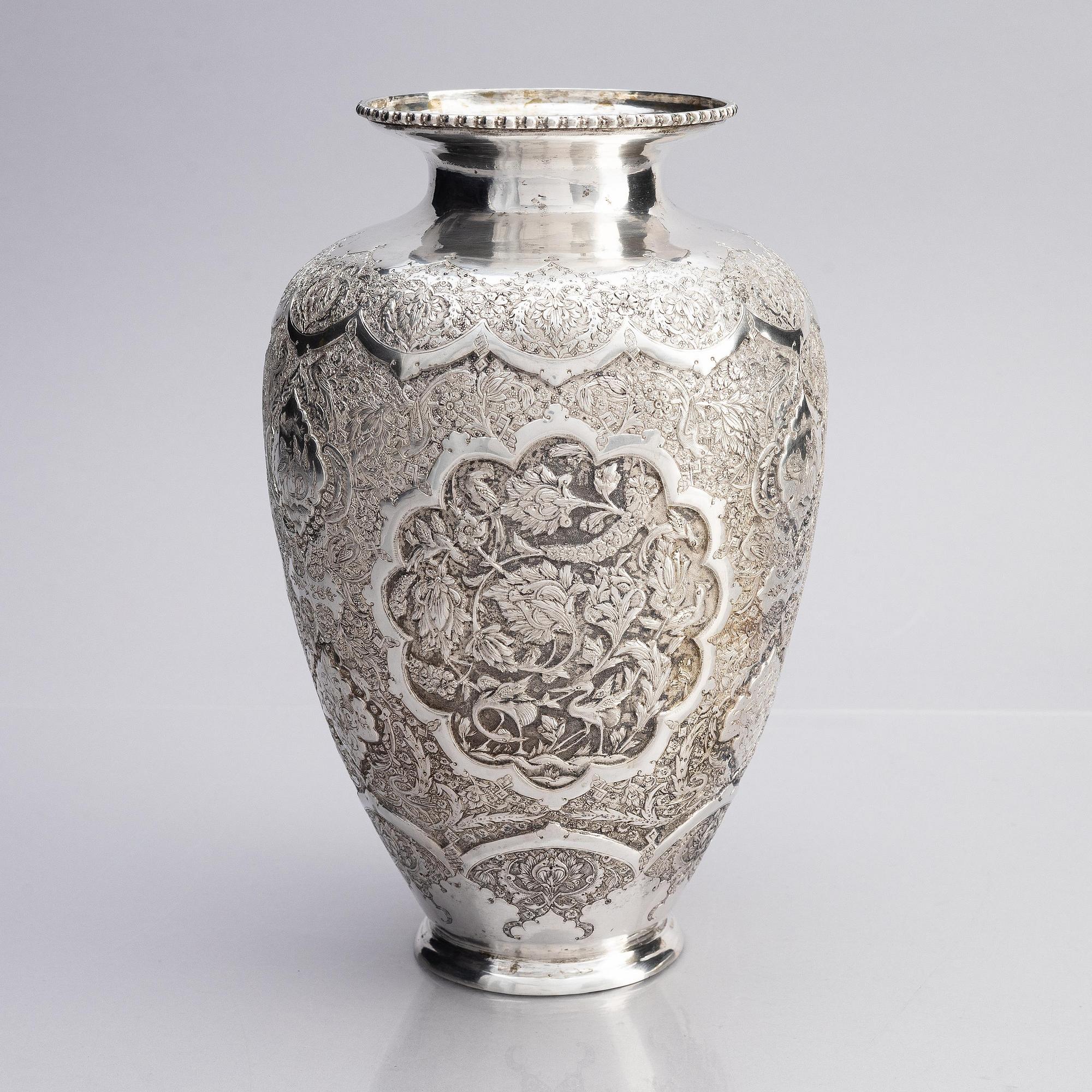 A Persian silver vase, late Qajar dynasty around 1910.