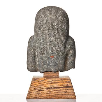 An Egyptian black granite bust of a man, 19th century or older.