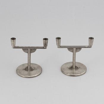 A pair of 1935 pewter candelabras by K E & Co.