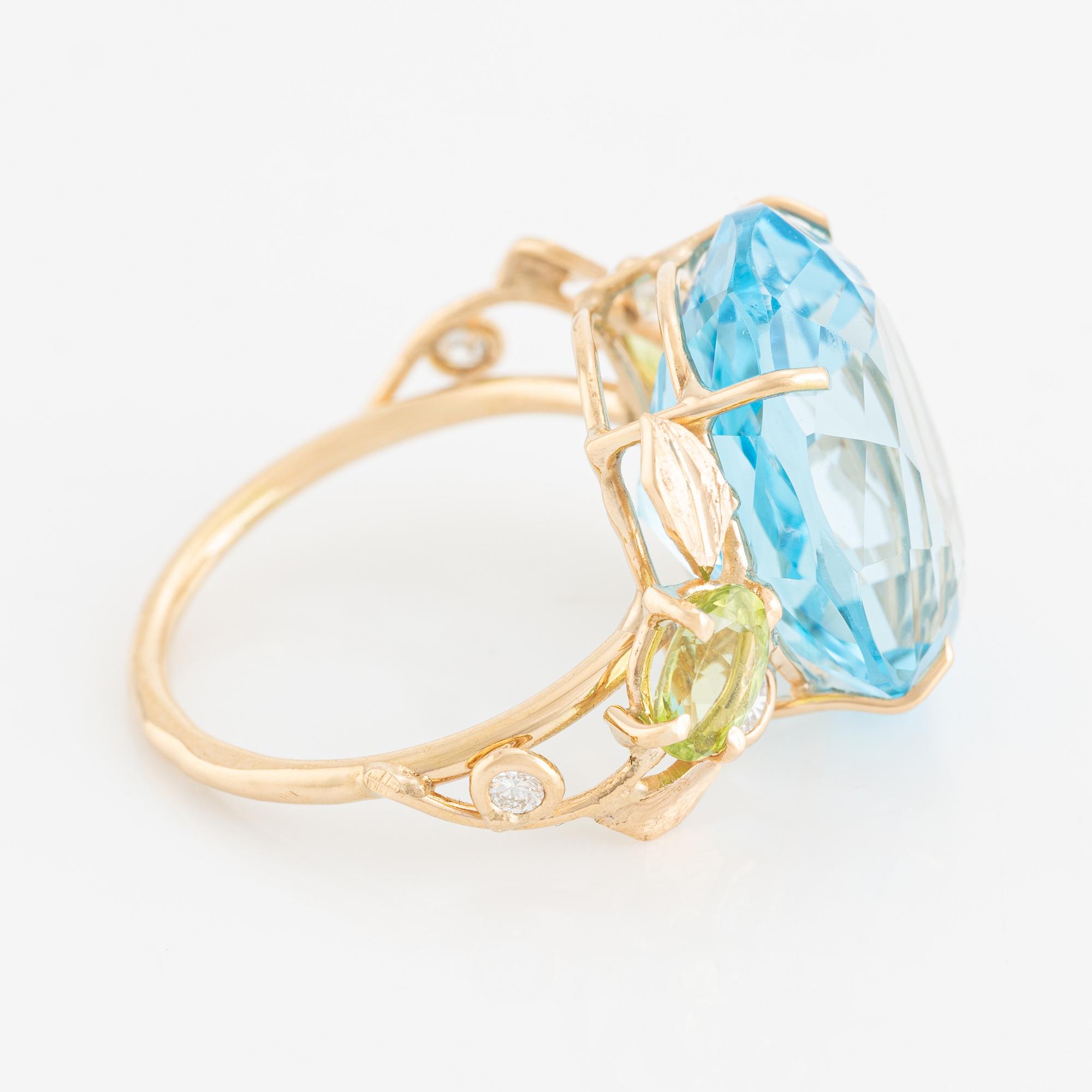 Ring, cocktail ring with blue topaz, peridot, and brilliant-cut diamonds.