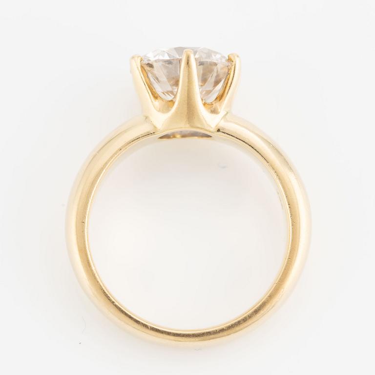 Ring, 18K gold with a round brilliant-cut diamond.