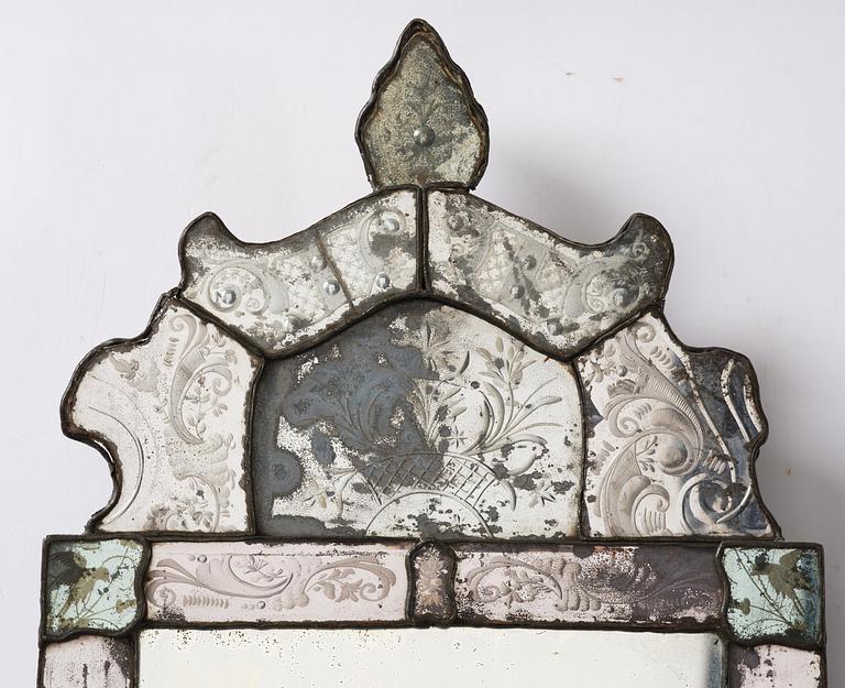 A Northern European late baroque engraved glass mirror, first part 18th century.