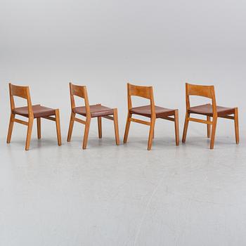 Four oak chairs with leather seat by John Vedel Rieper, Denmark, 1962.