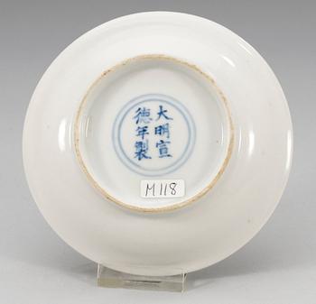 A white-glazed dish, Ming dynasty, with Xuandes six character mark and period (1426-35).