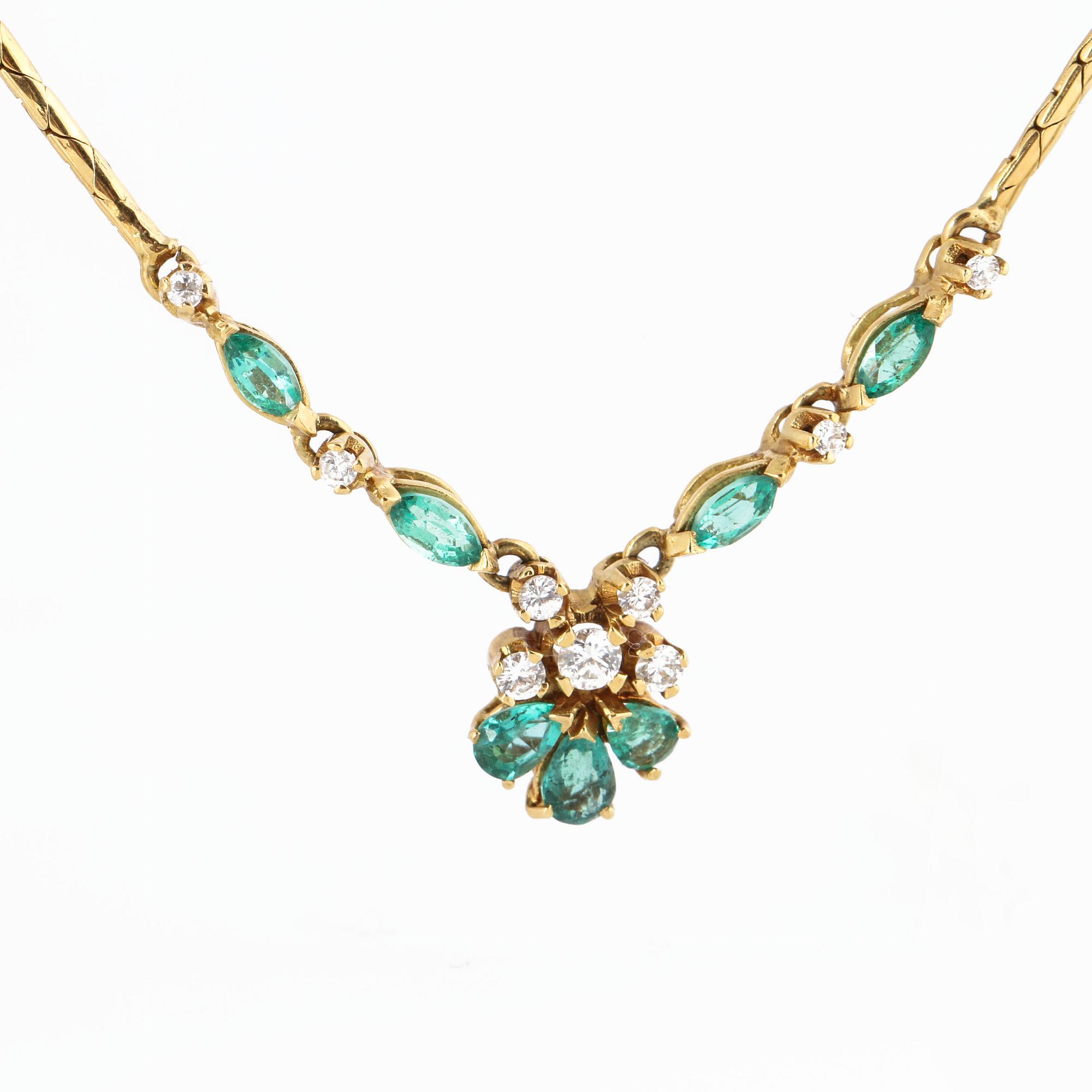 A emerald and brilliant cut diamond necklace.