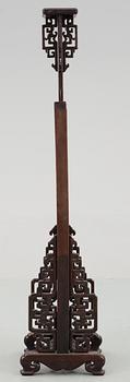 A hardwood lantern stand, with carved stylized dragons, presumably late Qing dynasty.