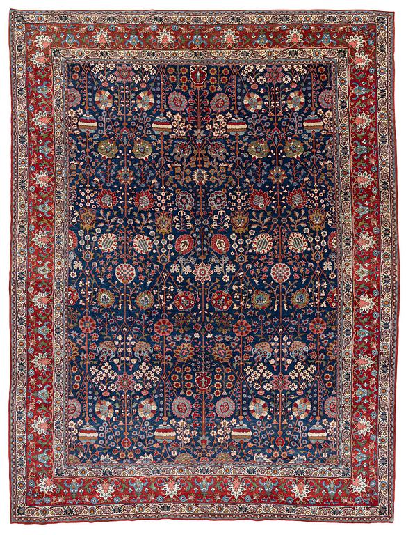 A semi-antique Qum carpet of Safavid design, Central Persia (Iran), c. 416 x 315 cm.