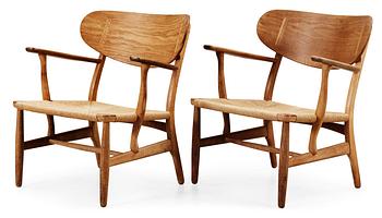 75. A pair of Hans J Wegner easy chairs by Carl Hansen & Son, Denmark.
