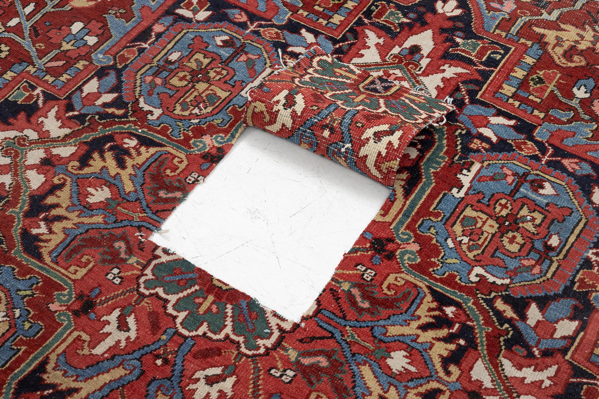 An Antique Heriz carpet, North west persia, c. 380 x 310 cm.
