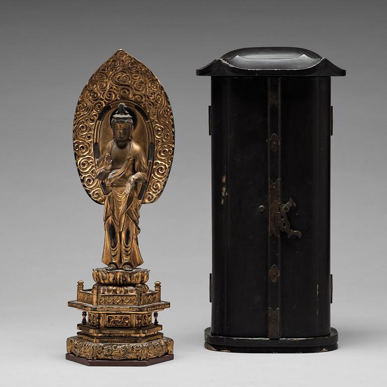 A Japanese gilt and lacquered wooden figure of Buddha and a travel shrine, Edo Period, 19th century.