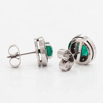 A pair of ca. 13K white gold earrings with emeralds and diamonds totaling approx. 0.36 ct.