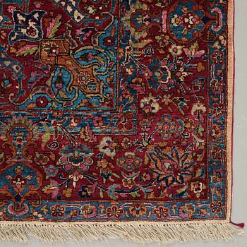 A CARPET, a semi-antique silk Kashan, ca 208,5 x 130 cm.