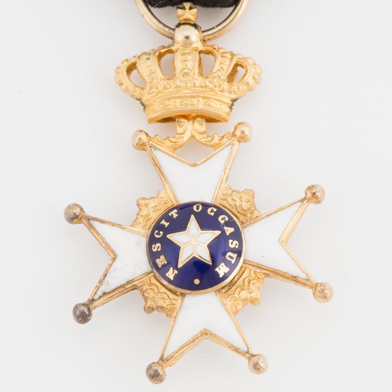A gilded metal Miniature of the The Royal Swedish Order of the Polar Star with black ribbon.