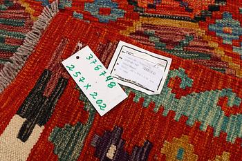 An Afghan kilim carpet, c. 257 x 202 cm.