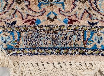 A oriental signed Nain silk carpet. Circa 267x163 cm.