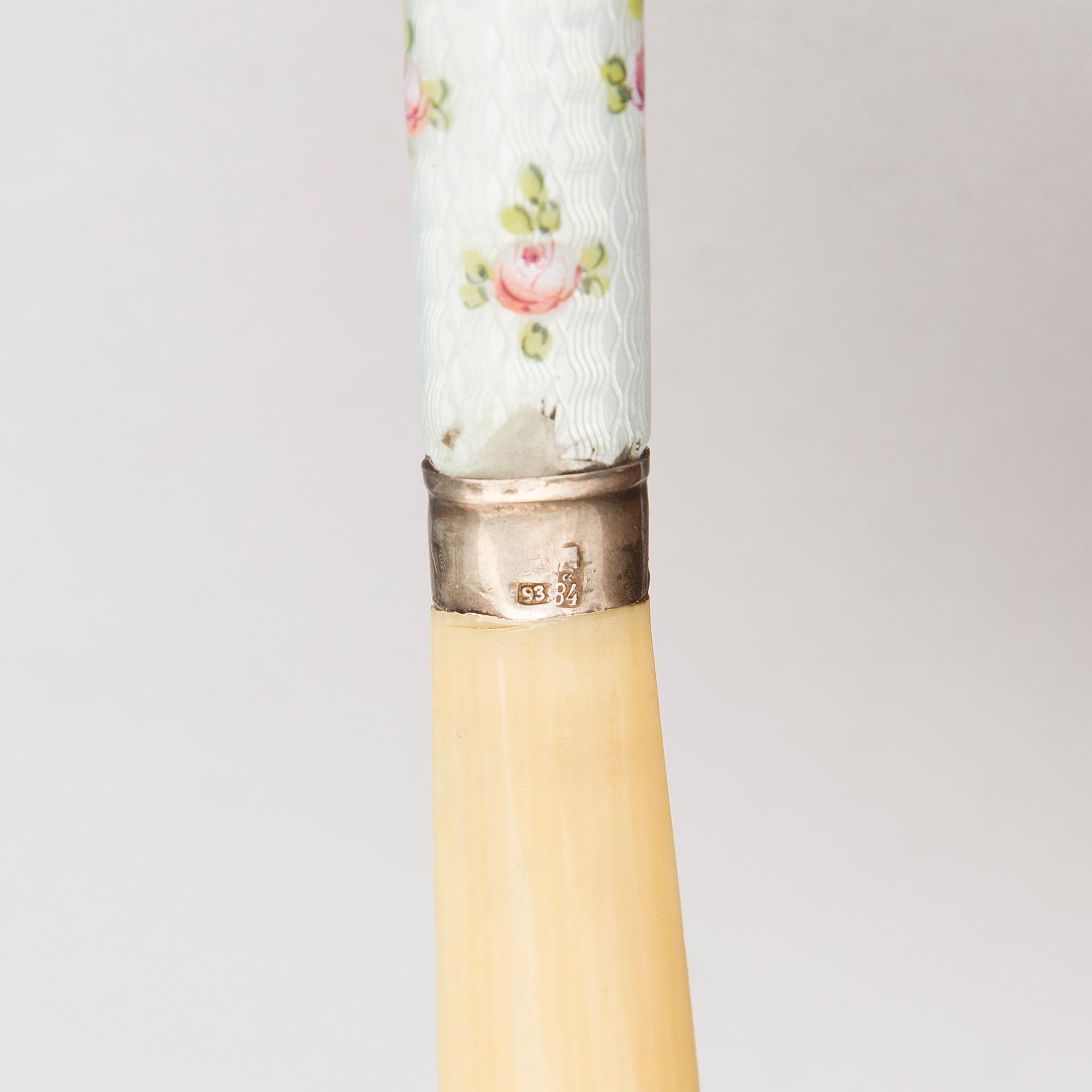 A silver case, Nikolai Kemper, and a pen and a paper knife in silver and enamel, import marks St Petersburg early 1900s.